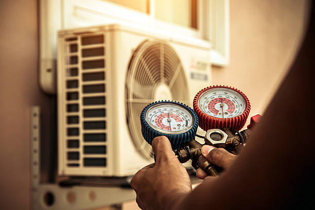 Professional Heat Pump Repair technician working in Grass Lake, MI